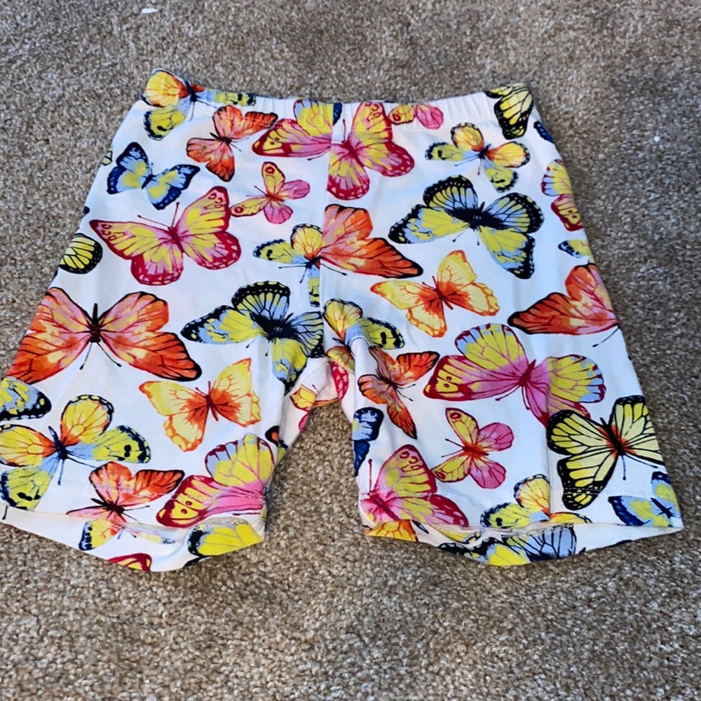 Biker shorts with colorful butterfly’s all over.